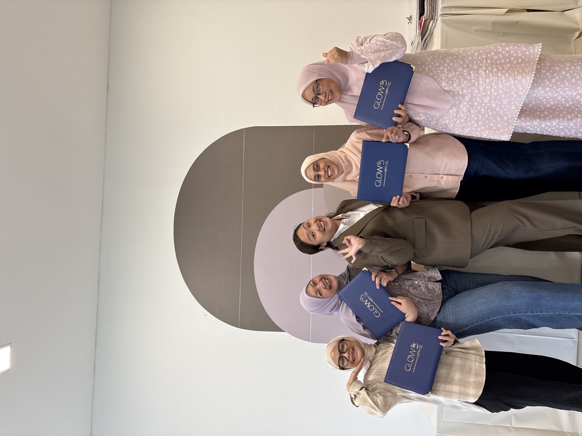 CPCS graduates group photo with Stephenie holding their certificates